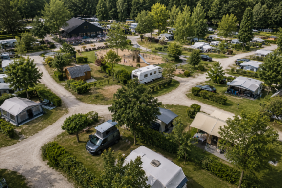 Well-organized campsite layout with spacious pitches and greenery
