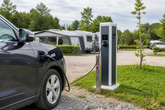 Electric vehicle charging station at a modern campsite